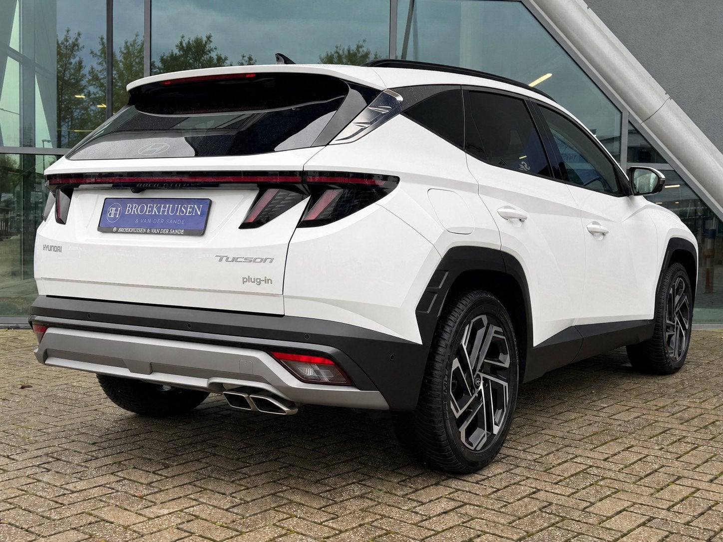 Hyundai Tucson 1.6 T-GDI PHEV Premium Sky 4WD 265pk Leder /, Auto's, Automaat, Dealer onderhouden, Zwart, 4 cilinders