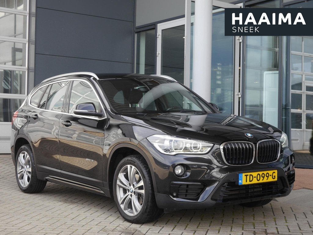 BMW X1 sDrive18i Executive | Automaat | Trekhaak | Camera |, Auto's, Zwart, 19 km/l, 3 cilinders, 1405 kg