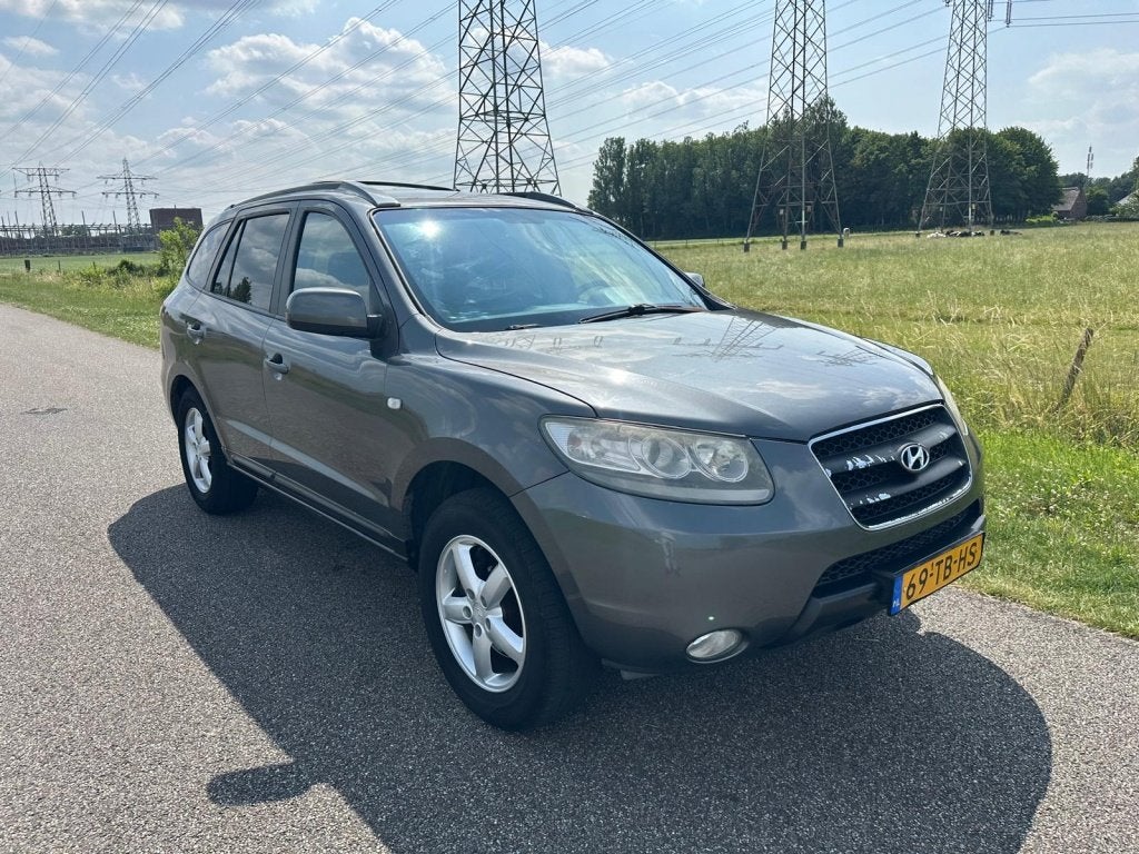 Hyundai Santa Fe 2.7i V6 Dynamic 7p. (bj 2006), Auto's, Automatische klimaatregeling, Santa Fe, 2000 kg, Bedrijf