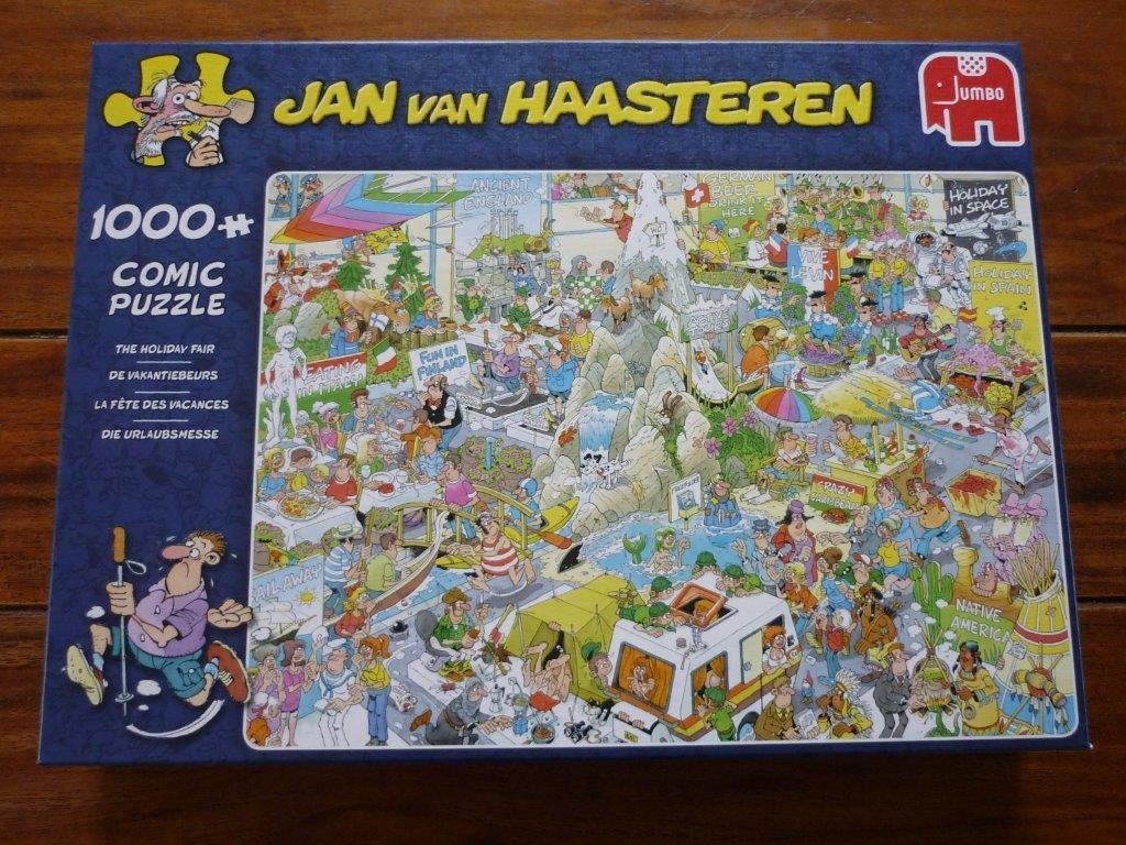 de Vakantiebeurs 1000 st. - Jan van Haasteren puzzel, Ophalen of Verzenden, 500 t/m 1500 stukjes, Zo goed als nieuw, Legpuzzel