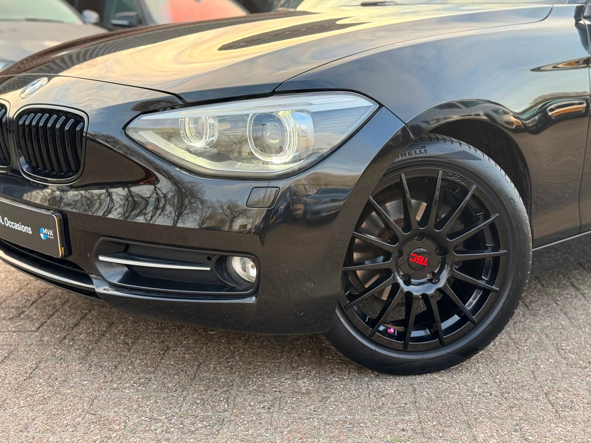 BMW 1-serie 114i EDE Corporate Lease Edition Sport|Nieuwe Ke, Auto's, 1-Serie, Gebruikt, 4 cilinders, Zwart