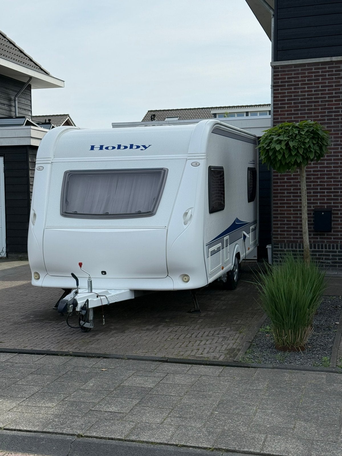 Te koop hobby 455 UF 2010 met unico luifel, Caravans en Kamperen, Rondzit, Hobby, Dwarsbed, Particulier