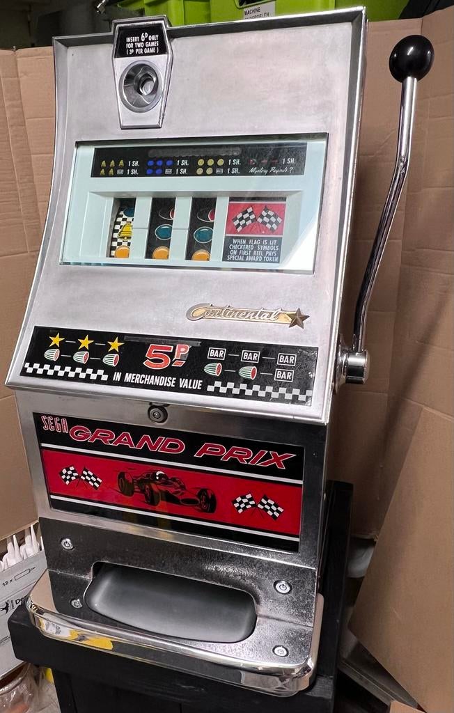 Vintage Sega Grand Prix bandiet - Continental, Verzamelen, Automaten | Gokkasten en Fruitautomaten, Overige munten, Ophalen, Gebruikt