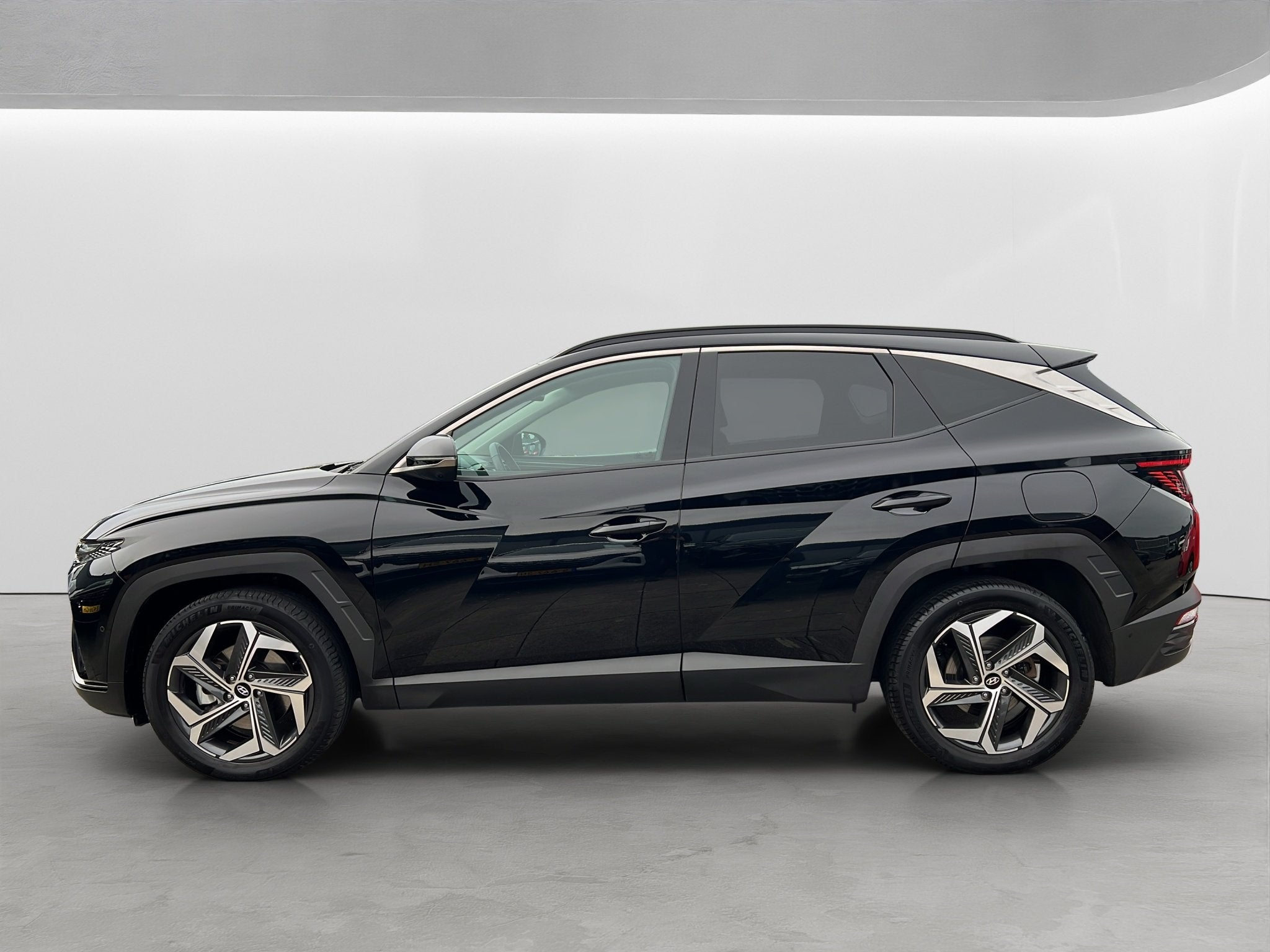 Hyundai Tucson 1.6 T-GDI 265PK PHEV Premium 4WD, Auto's, Hyundai, Gebruikt, 4 cilinders, Zwart, Bedrijf