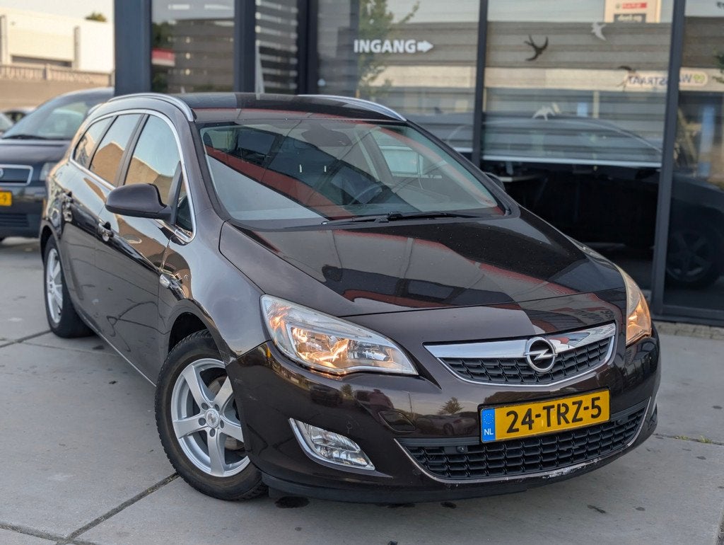 Opel Astra Sports Tourer 1.4 Turbo Cosmo LPG G3 - Leder - Tr, Auto's, Voorwielaandrijving, Euro 5, Stof, Gebruikt