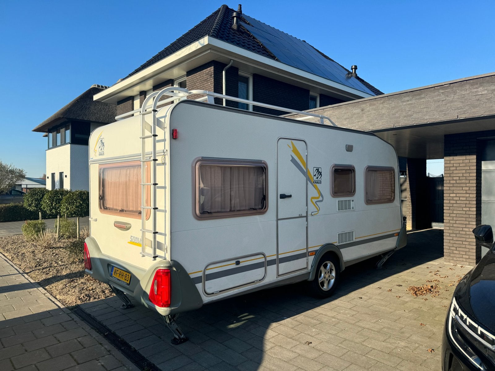 Knaus Sudwind 450 TU - Incl. Auto. Mover, voortent & luifel, Caravans en Kamperen, Rondzit, Omvormbare zithoek, Bedrijf, 4 tot 5 meter