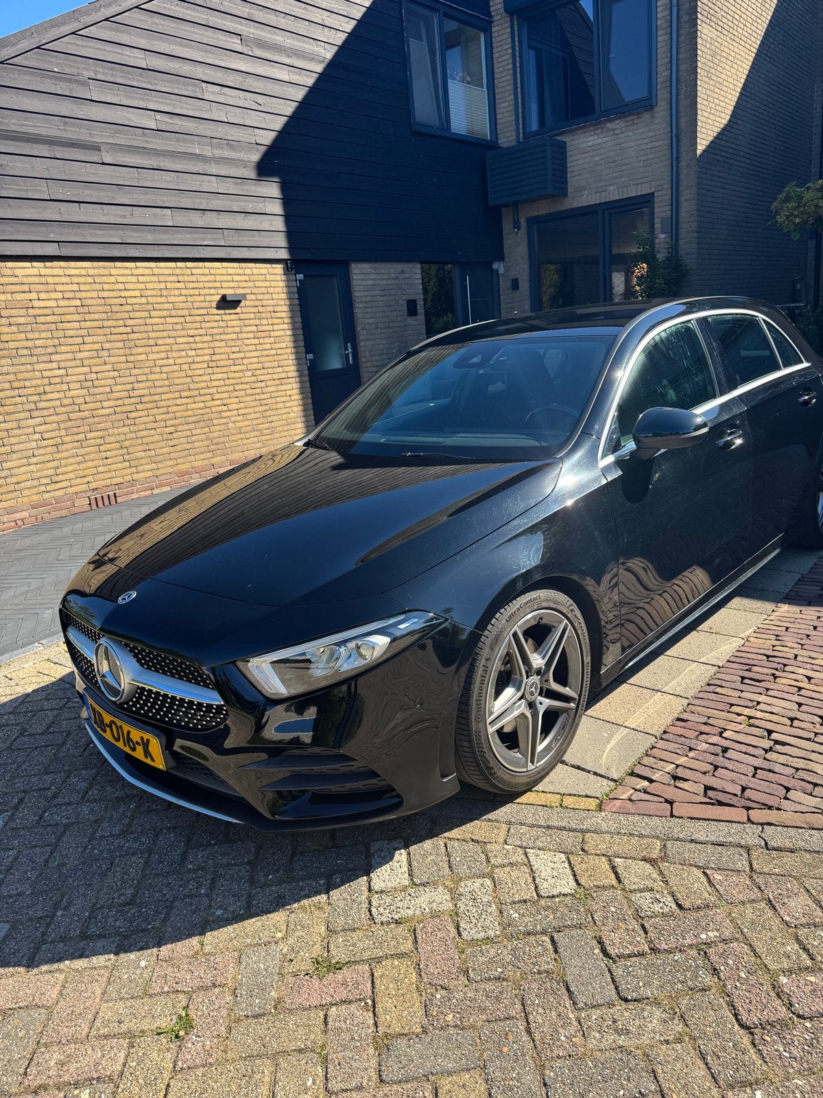 Mercedes-Benz A-Klasse A 160 AMG 2018 Zwart, Auto's, Voorwielaandrijving, Zwart, 4 cilinders, Zwart