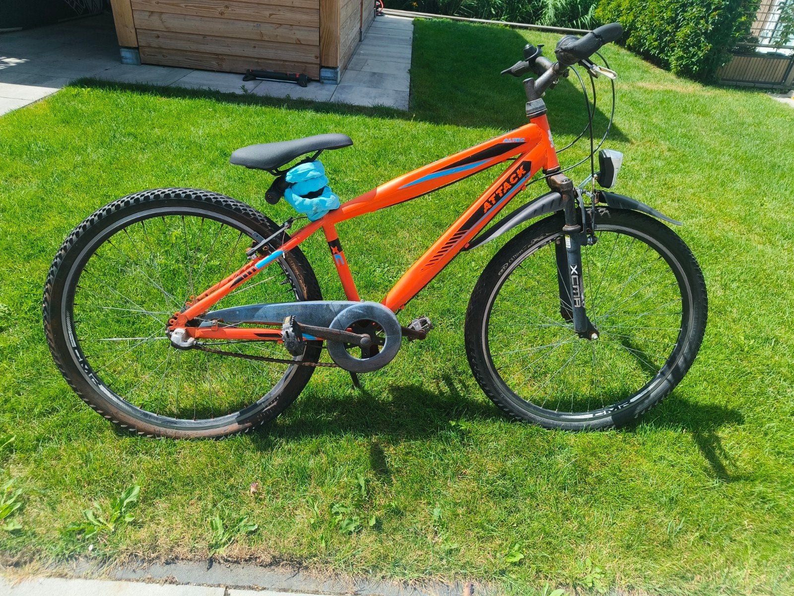 Kinder mountainbike in oranje kleur, Ophalen, Gebruikt, Velgrem, 20 inch of meer