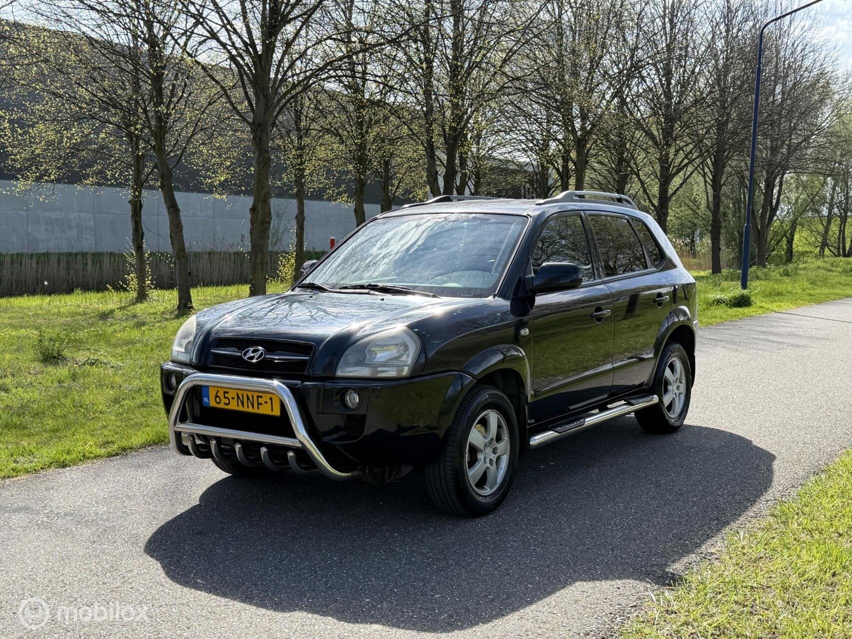 Hyundai Tucson 2.0i Active*LEDER*STOELVERWARMING*NEW APK, Auto's, Gebruikt, 4 cilinders, Stoelverwarming, Zwart