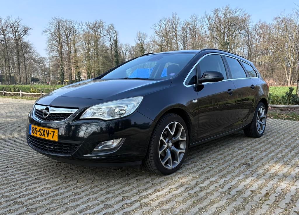 Opel Astra 1.4 16V Turbo Sports Tourer 2011, Auto's, Voorwielaandrijving, Stof, 4 cilinders, 1337 kg