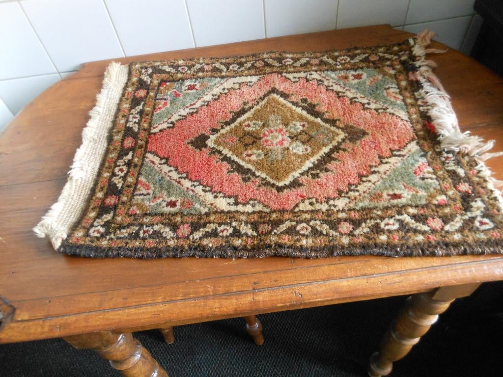 geknoopt tapijtje (perzische), Ophalen