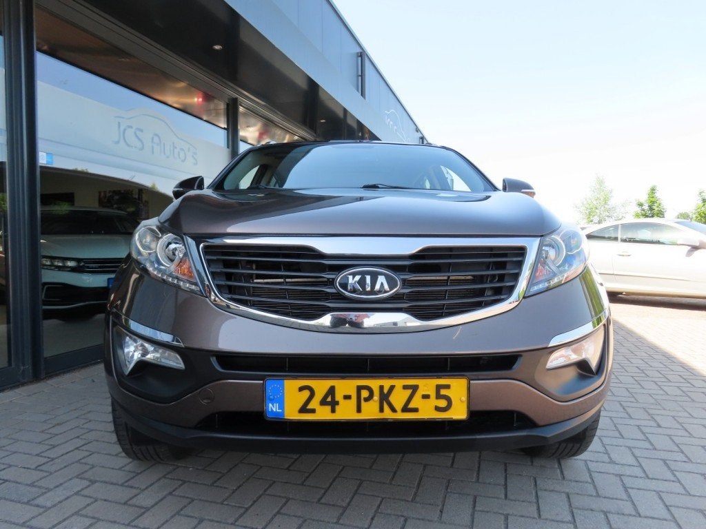 Kia SPORTAGE 2.0 X-ECUTIVE Plus Ecc Cruise Pano Trekhaak 201, Auto's, Gebruikt, 4 cilinders, Bruin, 163 pk