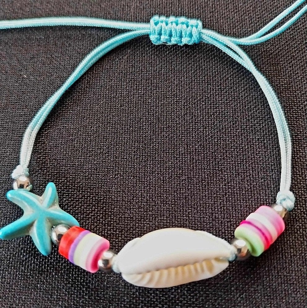 armbandje turquoise schelp zeester, Ophalen of Verzenden, Nieuw, Overige kleuren, Overige materialen