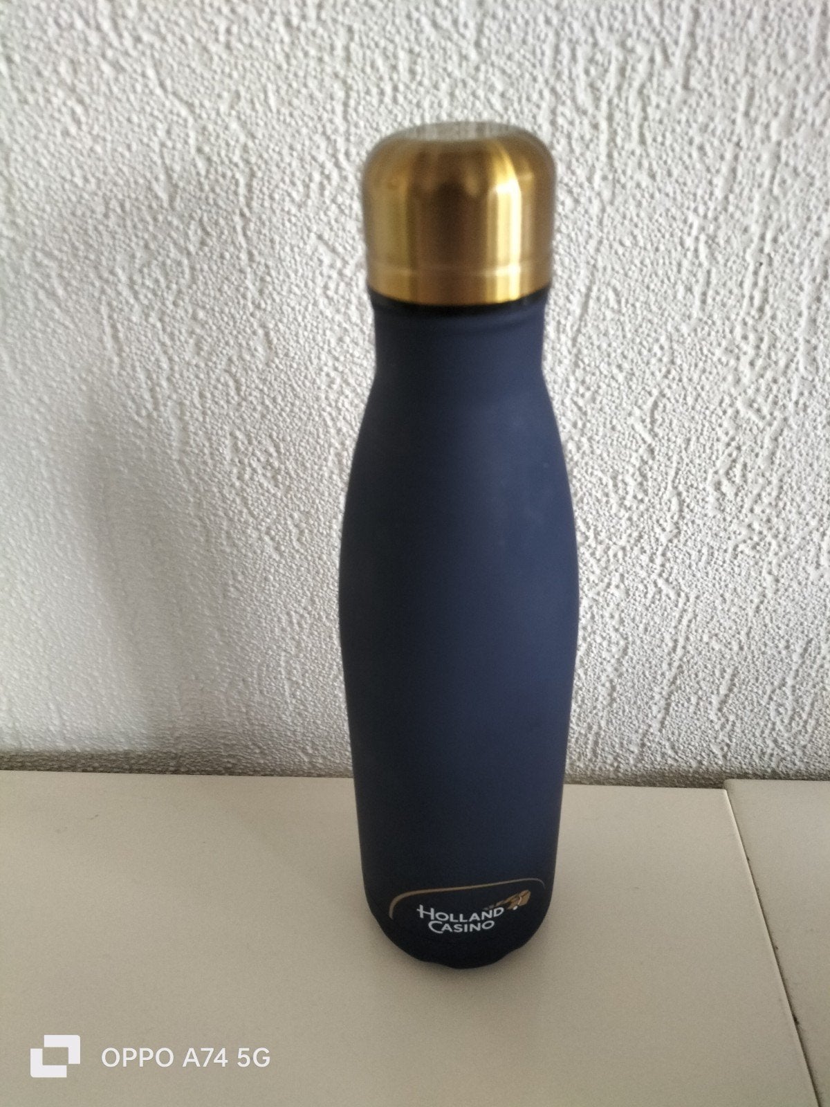 Holland Casino drinkfles - blauw met goudkleurige dop, Ophalen of Verzenden, Zo goed als nieuw, Metaal, Overige merken