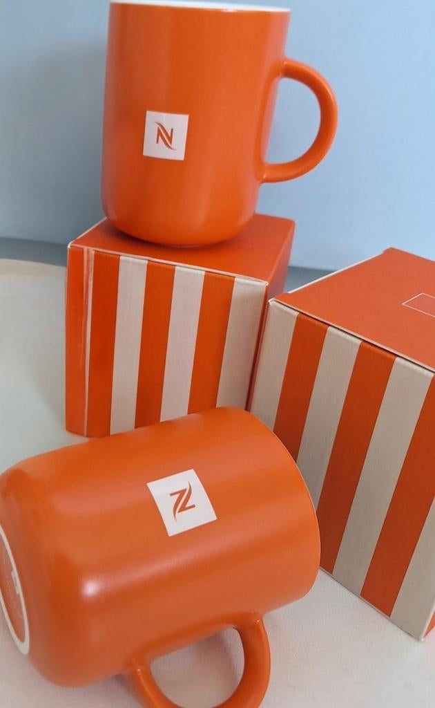 2x Nespresso koffiebeker, Mandarin Orange, porselein Nieuw, Ophalen of Verzenden, Nieuw, Oranje, Beker of Kan
