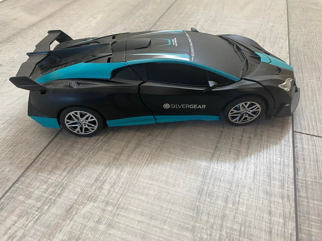 Zwarte en blauwe speelgoedauto die verandert in robot, Kinderen en Baby's, Speelgoed | Speelgoedvoertuigen, Ophalen, Gebruikt