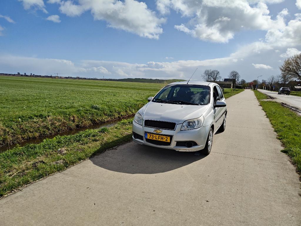 Chevrolet Aveo 1.2 16V 5D 2011 Grijs met nieuwe apk, Auto's, Chevrolet, Particulier, Aveo, ABS, Airbags, Airconditioning, Bluetooth