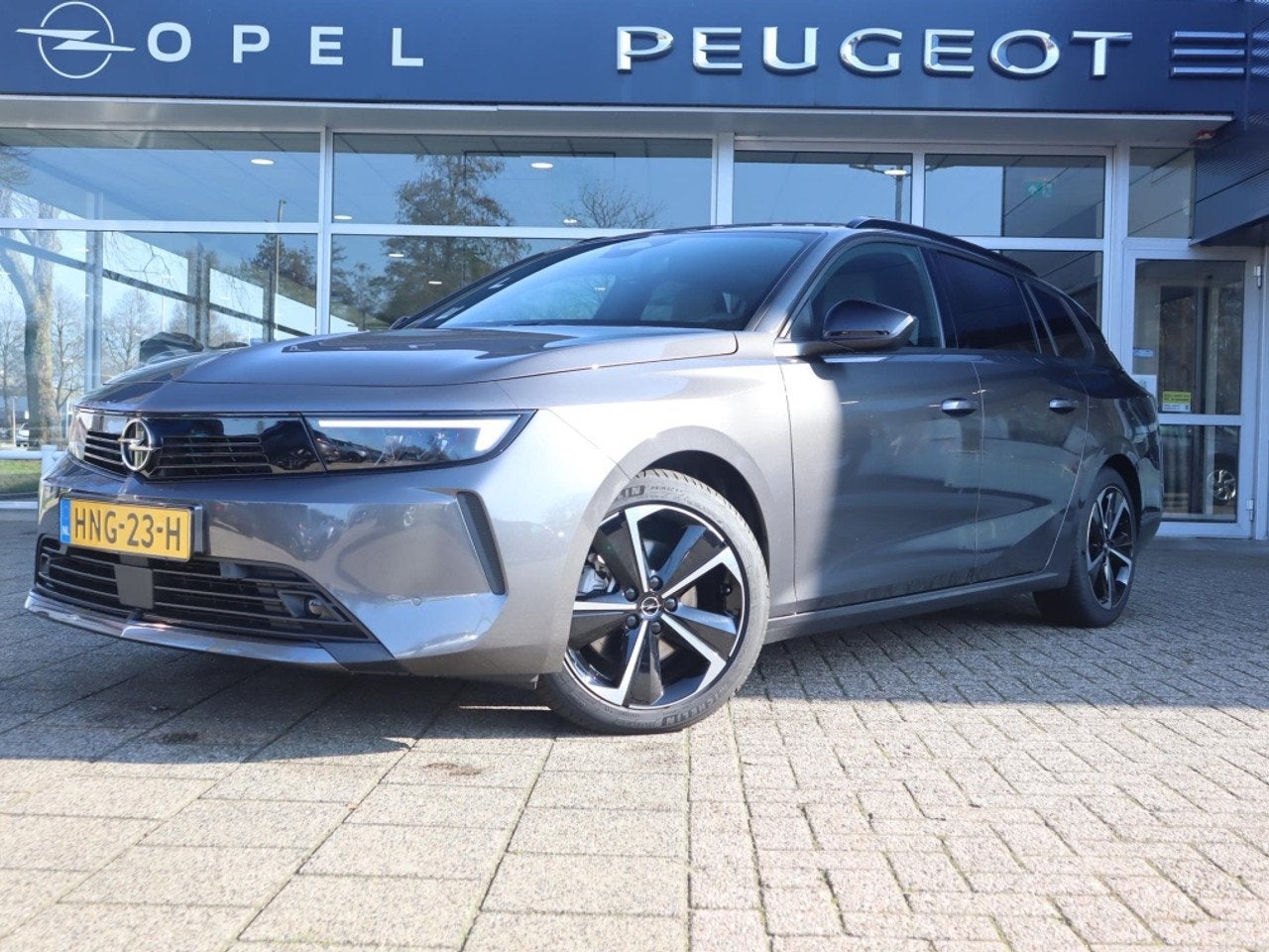 Opel Astra Sports Tourer Business Edition Turbo Hybrid 145pk, Auto's, Automaat, 145 pk, Lichtsensor, Gebruikt