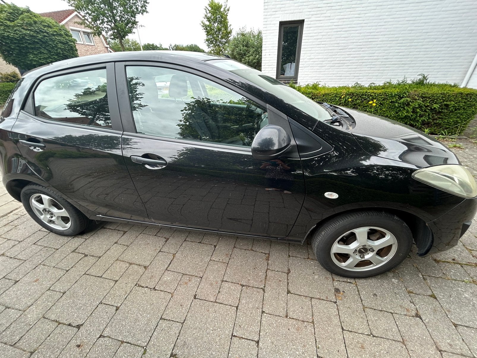 Mazda 2 1.3 Bifuel 75pk 5D 2011 Zwart, Voorwielaandrijving, 74 pk, 4 cilinders, Zwart