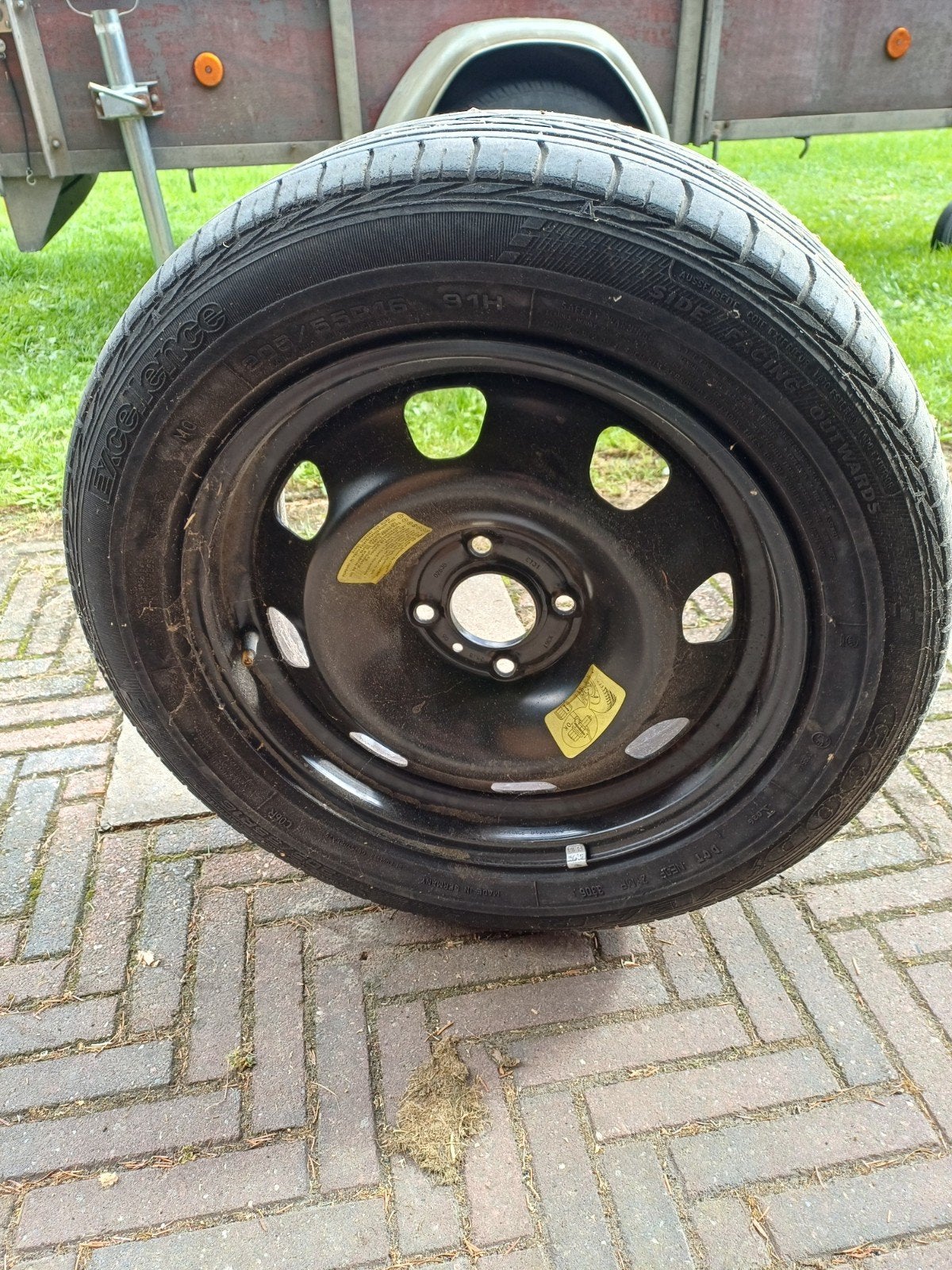 Autoband met metalen velg, Ophalen