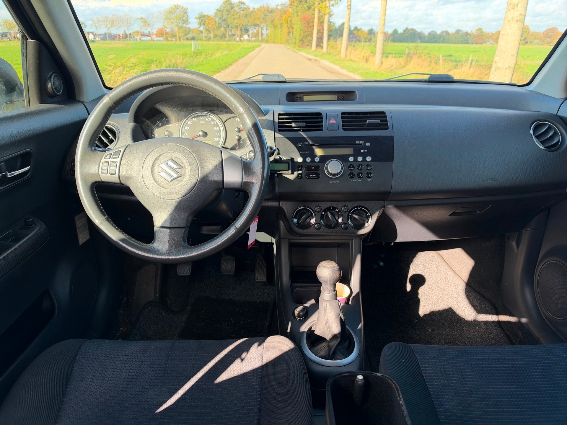 Suzuki Swift 1.3 Shogun APK 01-2027 Airco NAP 5Drs, Auto's, Voorwielaandrijving, Stof, Zwart, Swift