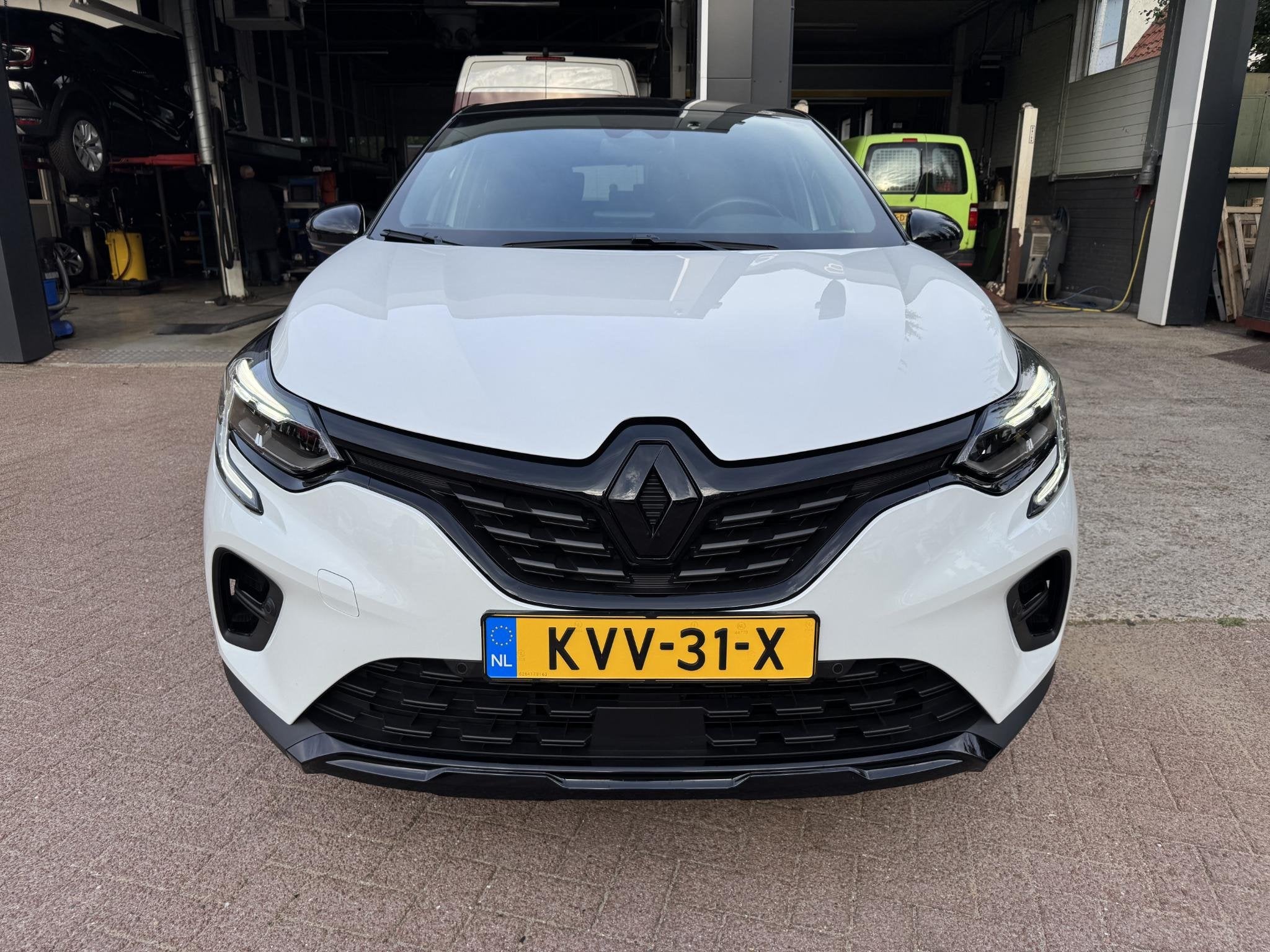 Renault Captur 1.6 E-Tech Hybrid 145 Rive Gauche, Auto's, Gebruikt, 715 kg, Leder en Stof, Wit