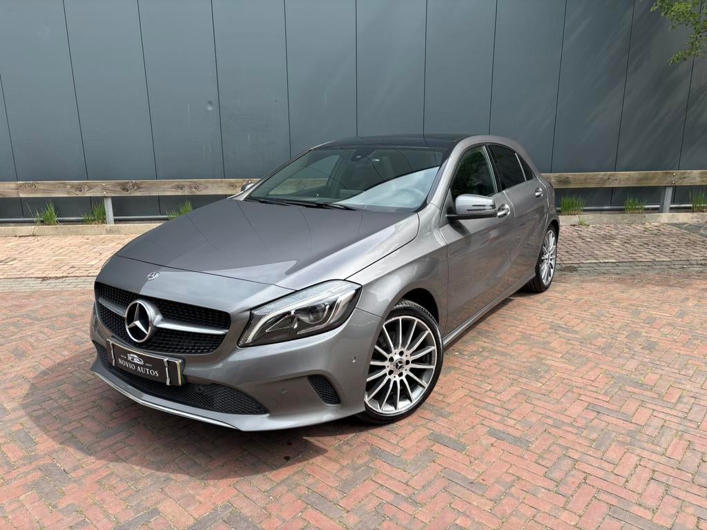 Mercedes-Benz A-Klasse A180 7G-DCT | PANO | CC | PDC | NAVI, 4 cilinders, Leder en Stof, 122 pk, Bi-Xenon koplampen