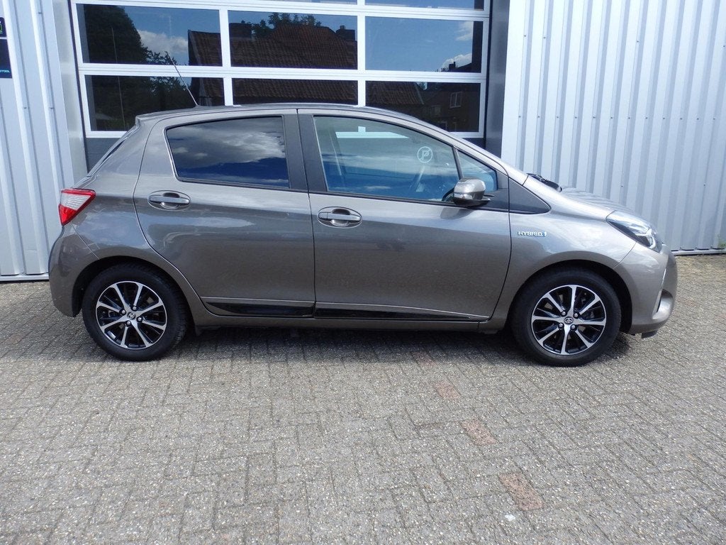 Toyota Yaris 1.5 Hybrid Comfort | Navi | PDC | Fietsdrager t, Auto's, Toyota, 12 maanden, 61 pk, Bedrijf, Grijs