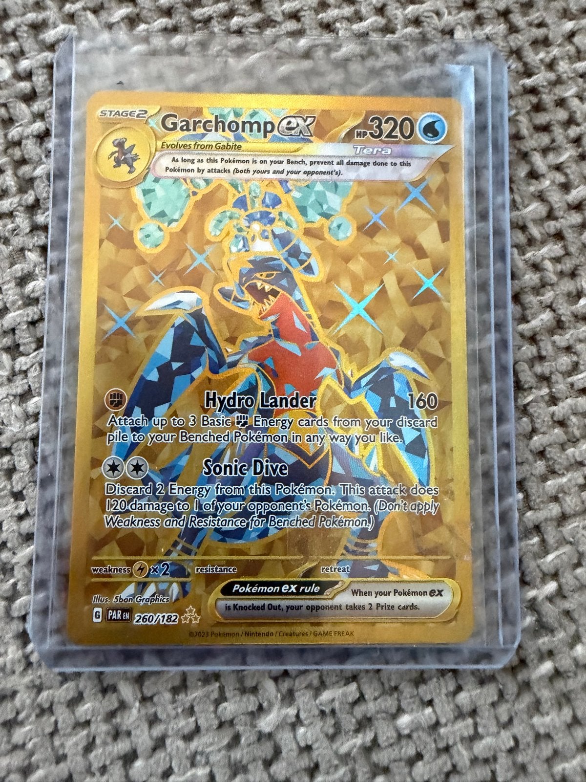 Garchomp ex 260/182 Gold Tera Pokémon Kaart, Ophalen of Verzenden, Zo goed als nieuw, Losse kaart, Foil