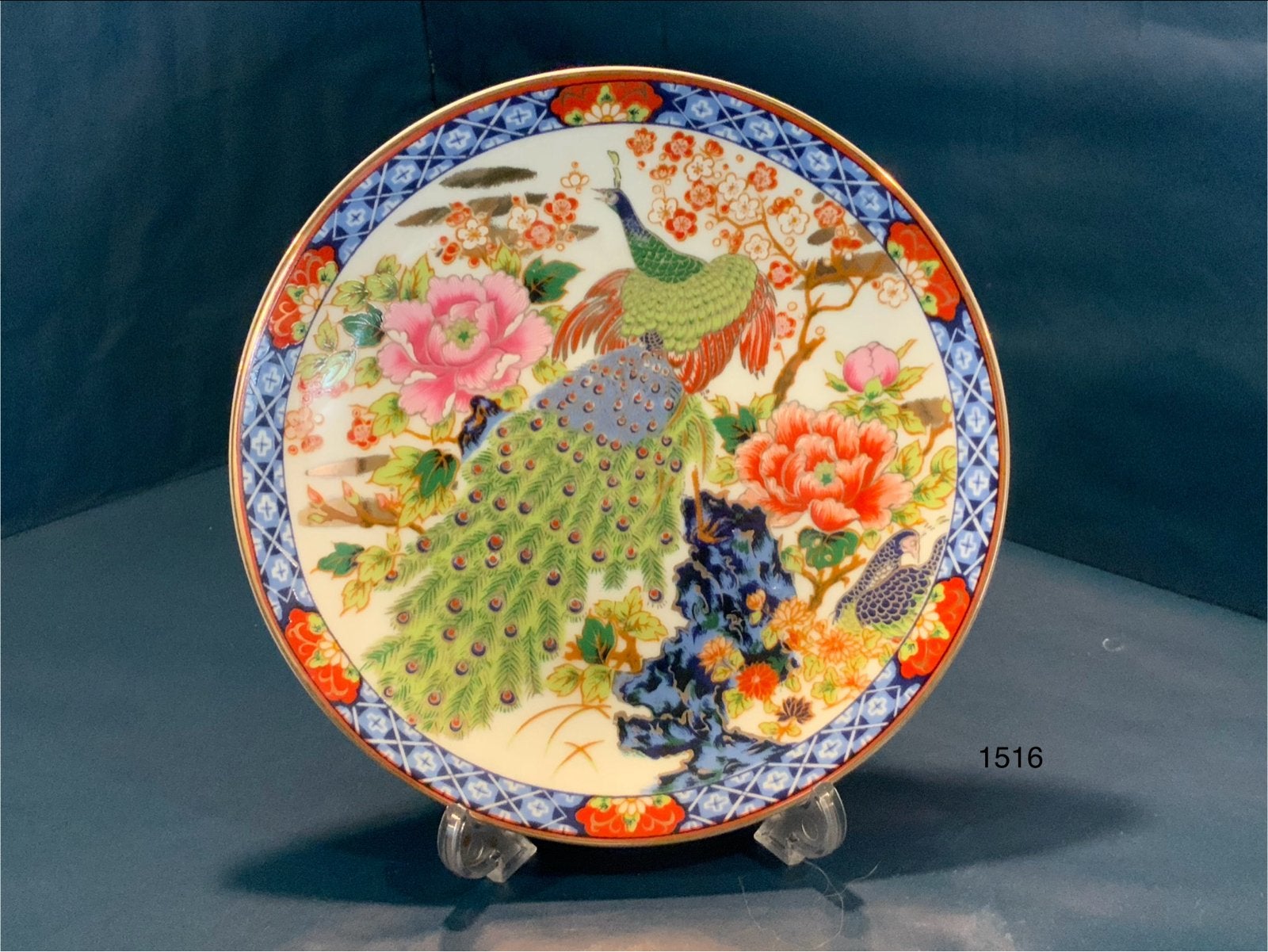 Decoratief bord met pauw en bloemen, Antiek en Kunst, Ophalen of Verzenden