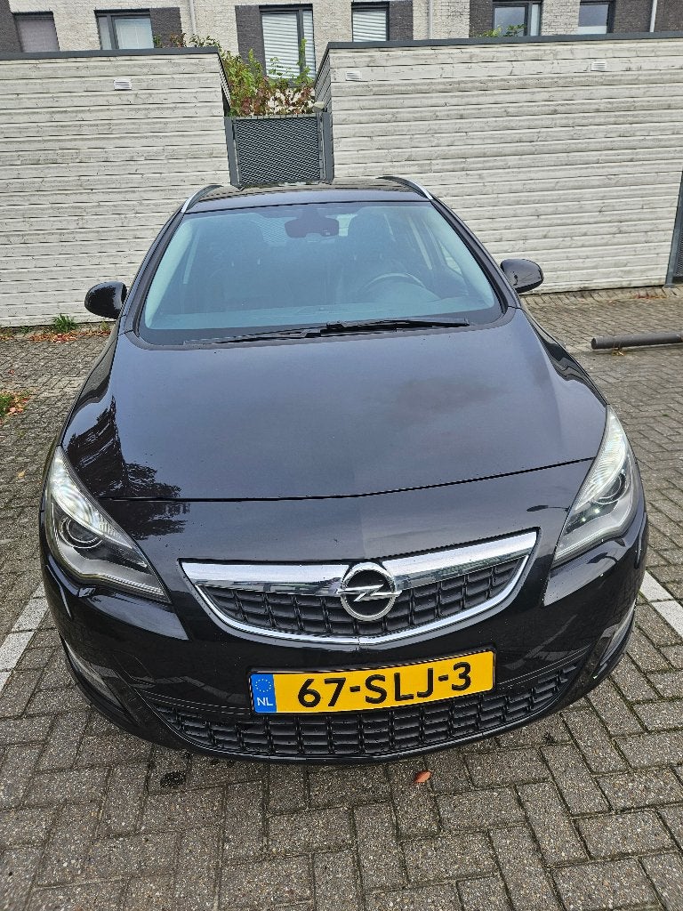 Opel Astra 1.4 Turbo 103KW ST 2011 Zwart, Auto's, Voorwielaandrijving, Zwart, 4 cilinders, 1337 kg