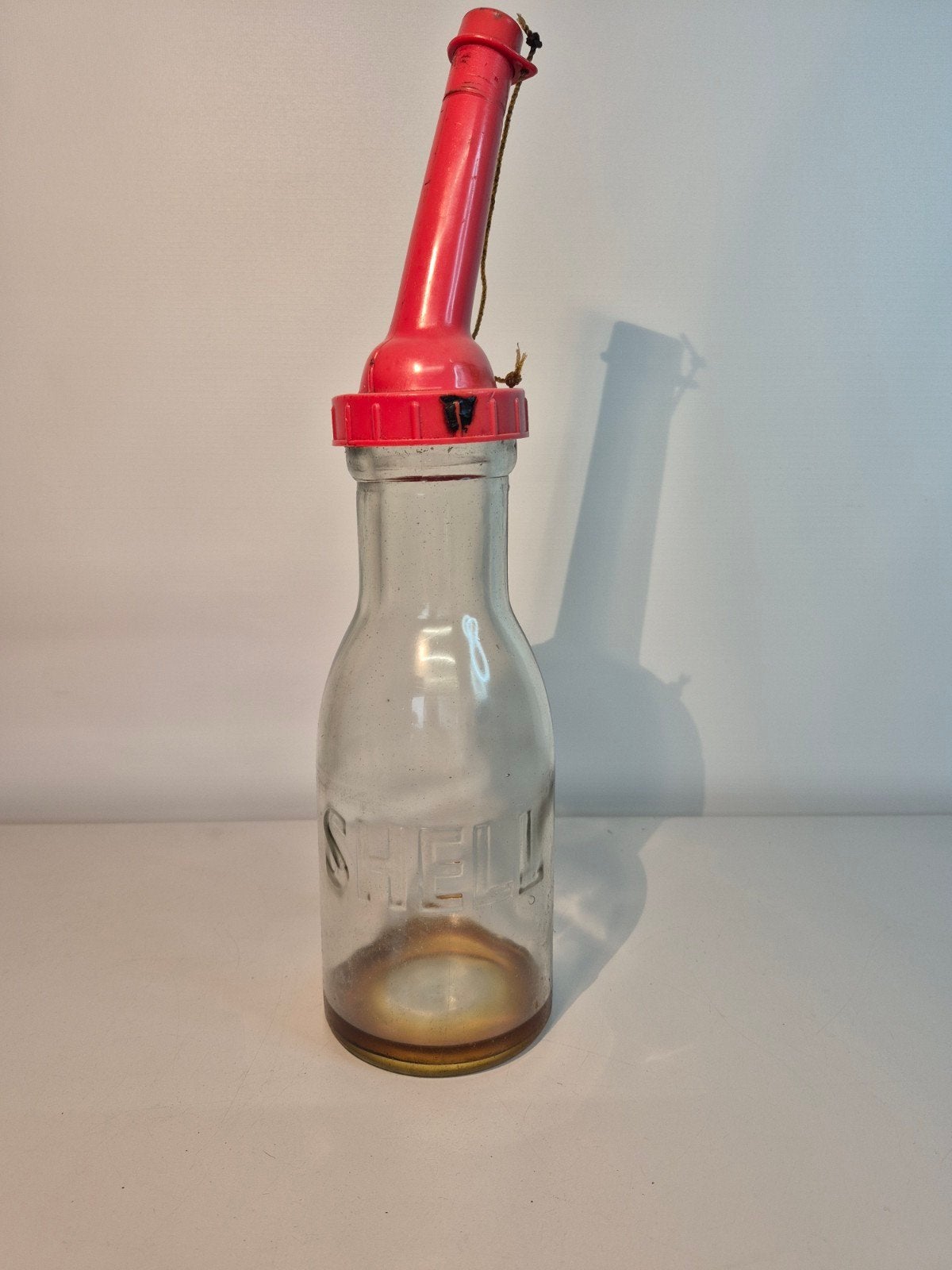 Antieke motor olie fles van shell, Antiek en Kunst, Ophalen of Verzenden