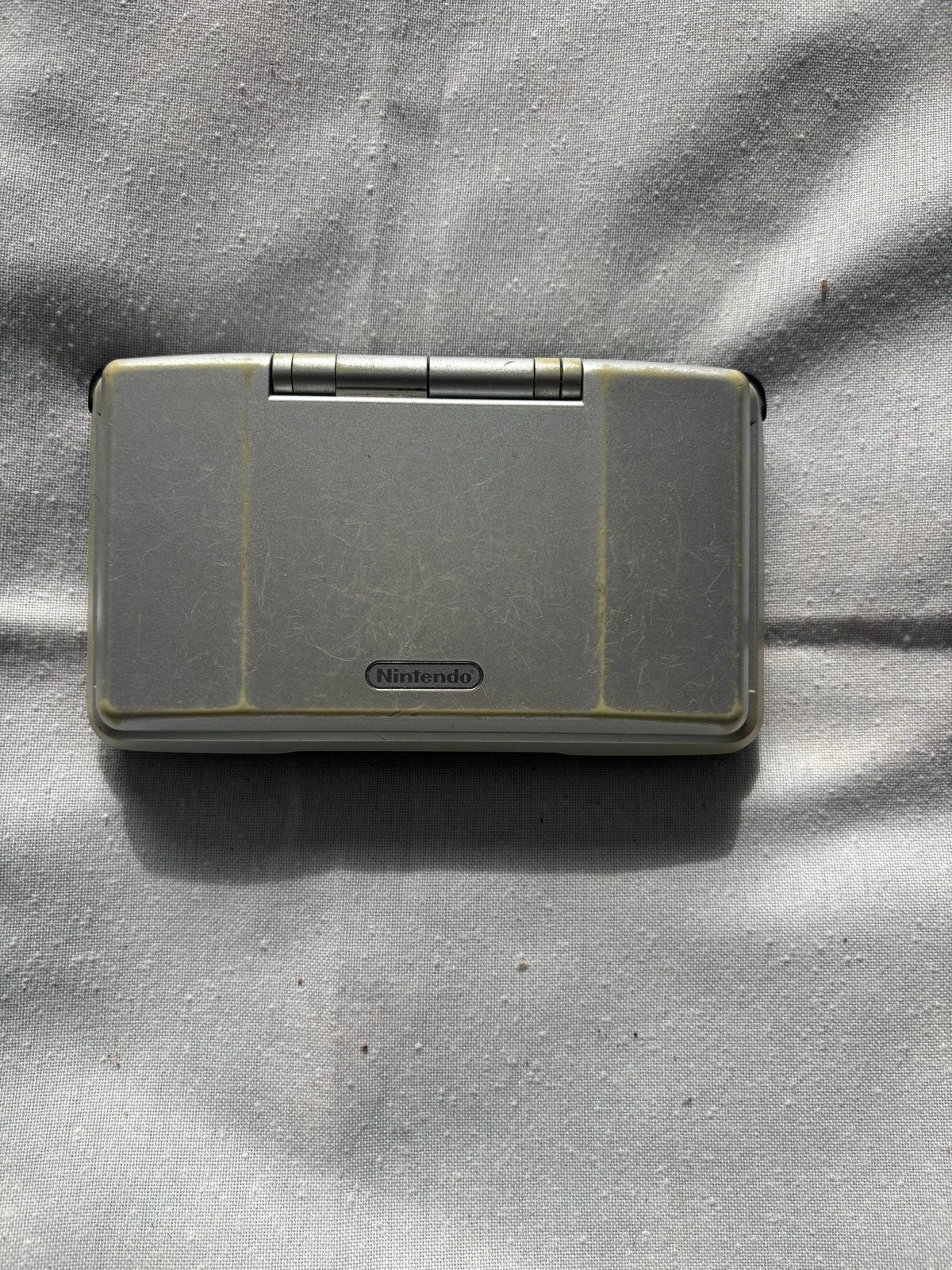 Nintendo DS (defect) - ideaal voor onderdelen of reparatie, Spelcomputers en Games, Ophalen of Verzenden, Niet werkend, Zilver