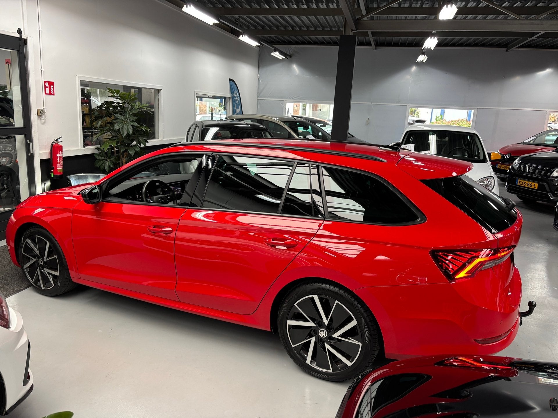Skoda Octavia Combi 1.0 TSI Sport Business / Navigatie, Dealer onderhouden, Stof, Gebruikt, Met garantie (alle)