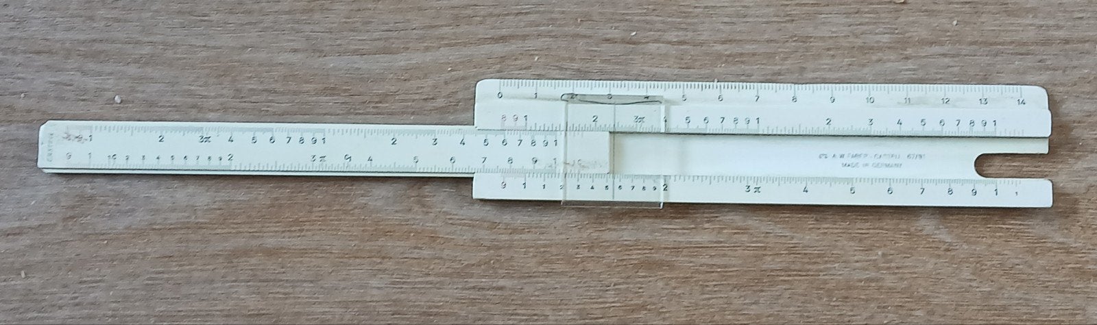 Rekenliniaal A.W. Faber-Castell 67/91 met leren koker, Ophalen of Verzenden