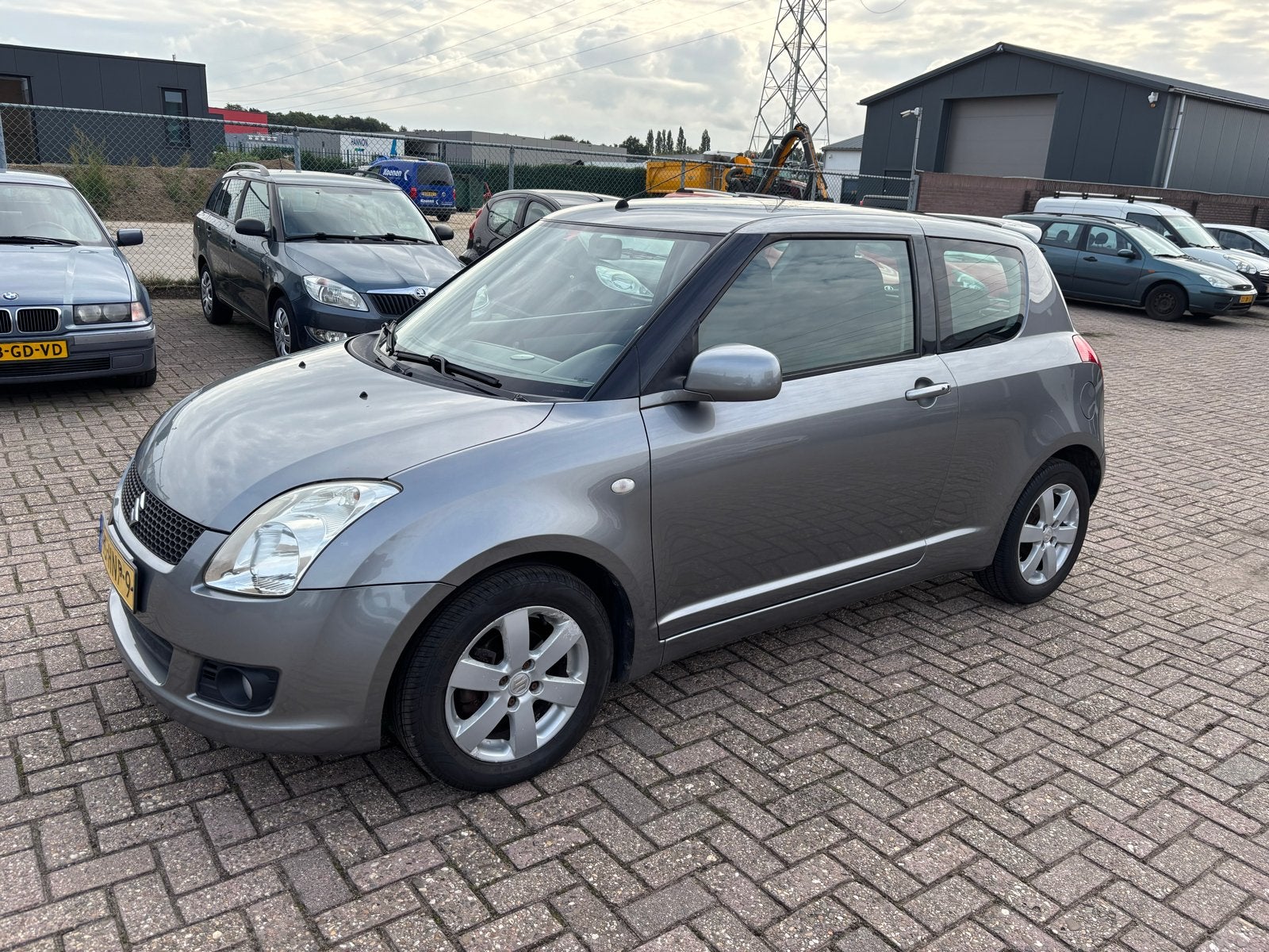 Suzuki Swift 1.3 3D 2009 Grijs Bandit, Auto's, Stof, 31 €/maand, Swift, Origineel Nederlands