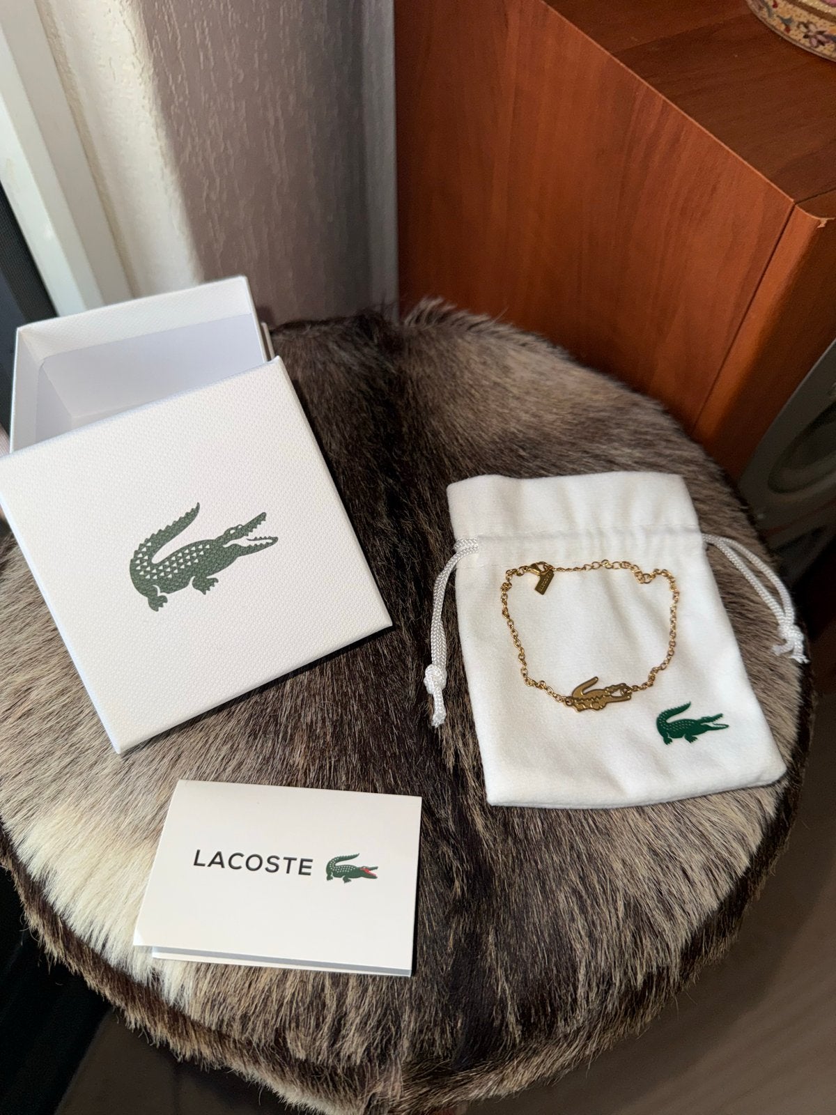 Nieuw Lacoste armbandje goudkleurig met krokodil, Overige materialen, Nieuw, Ophalen of Verzenden, Goud