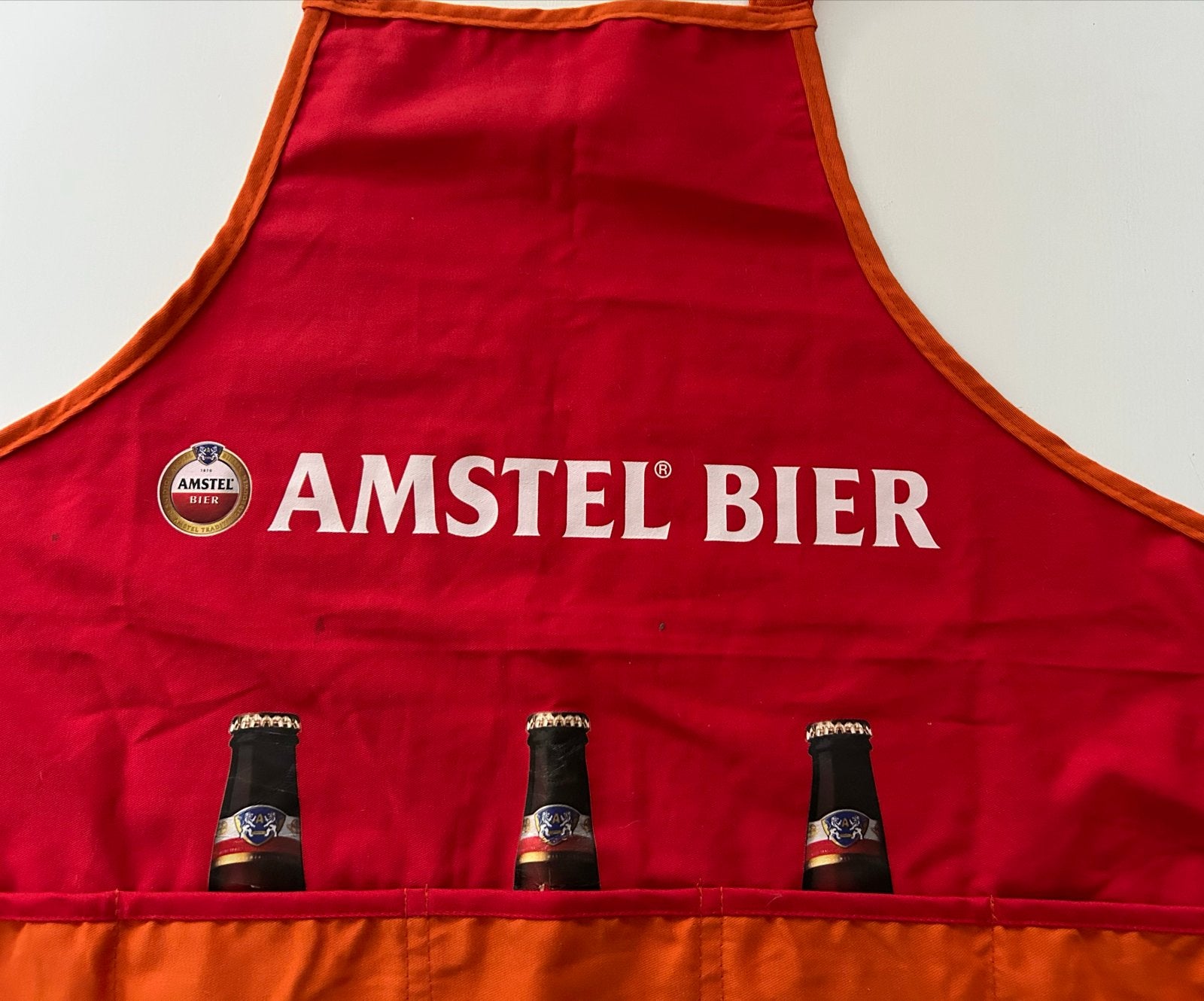 Amstel Bier schort Oranje met flesopener WK voetbal, Ophalen of Verzenden, Zo goed als nieuw, Kleding, Amstel