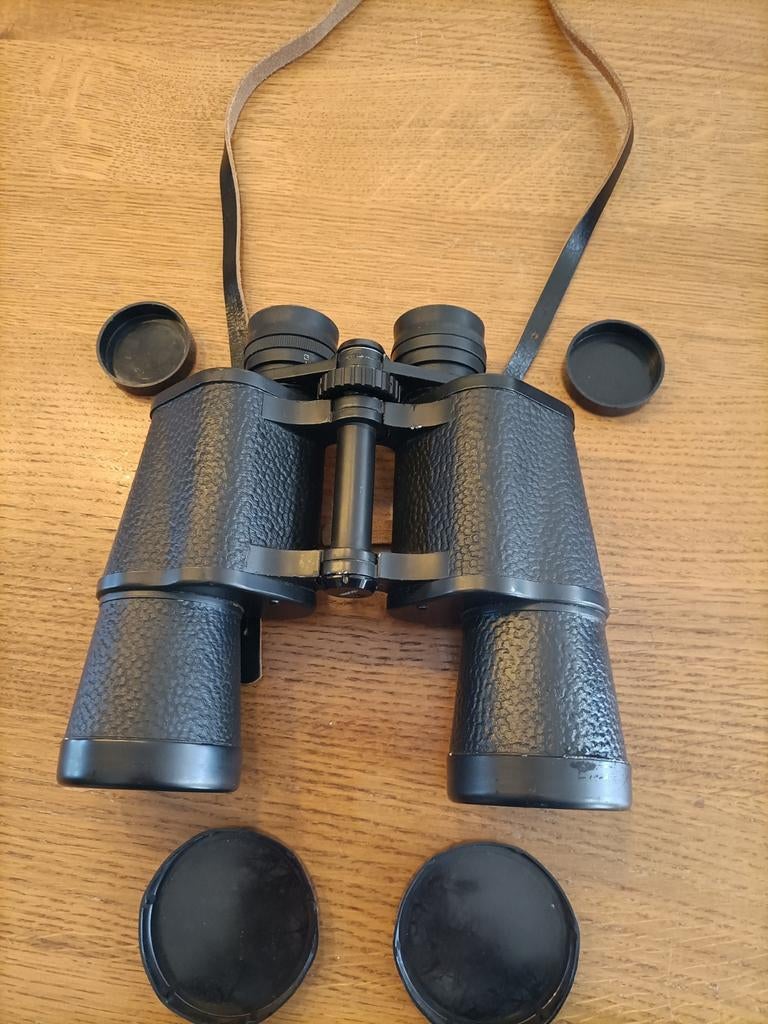 Revue 7x50 verrekijker met leren draagriem en lensdoppen, Gebruikt, Minder dan 8x, Met hoes of tas, Porro (met knik)