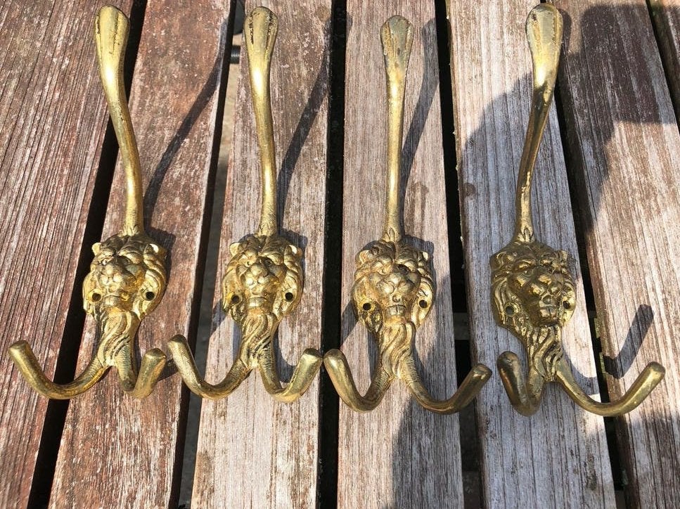 Set van 4 antieke messing leeuwenkop haken, Ophalen