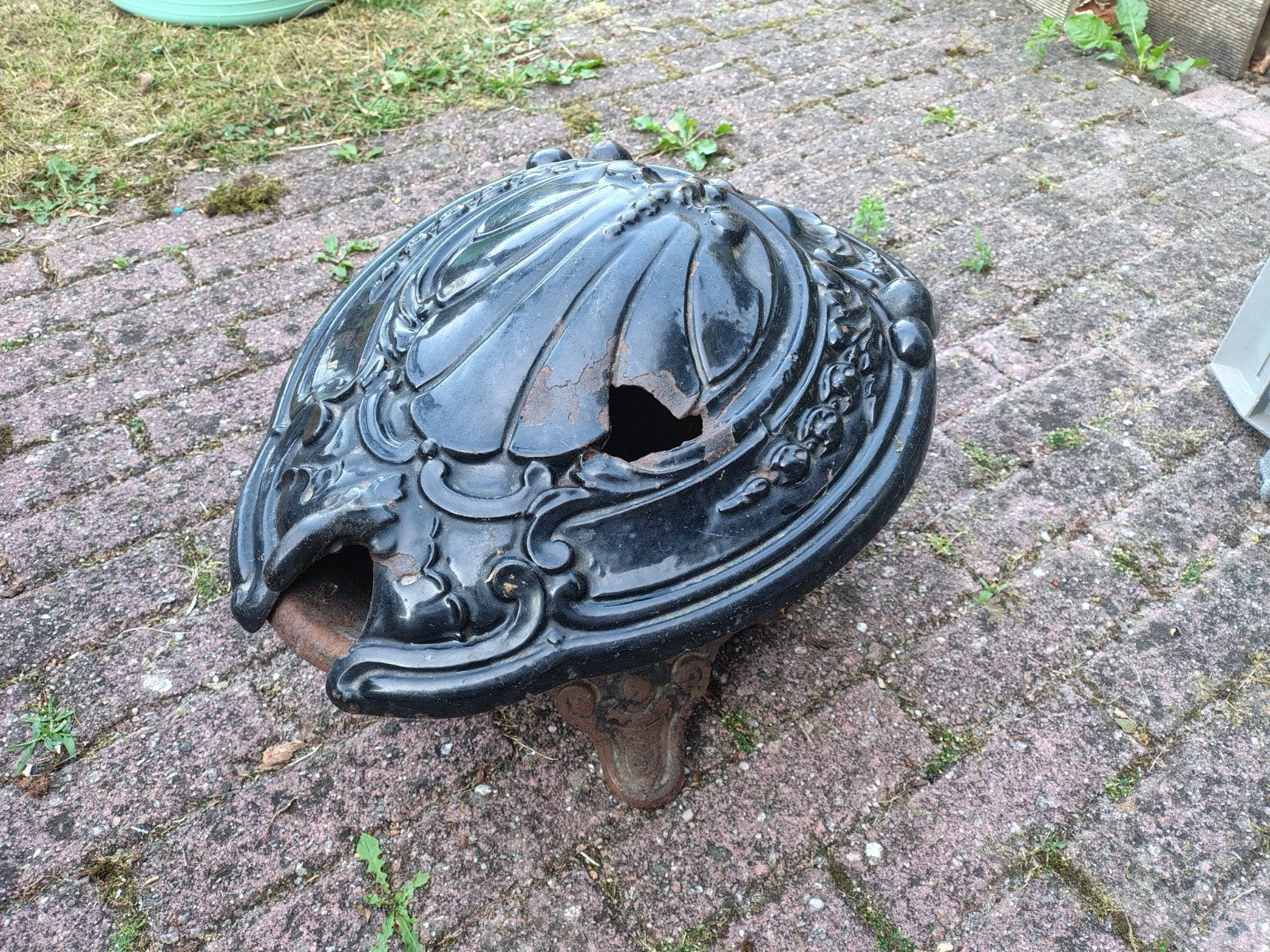 antieke gietijzeren kolenkit, Ophalen