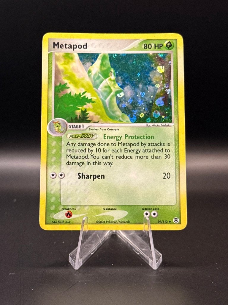 Metapod Holo	39/112	Engels	NM | Pokemon, Ophalen of Verzenden, Nieuw, Losse kaart, Foil