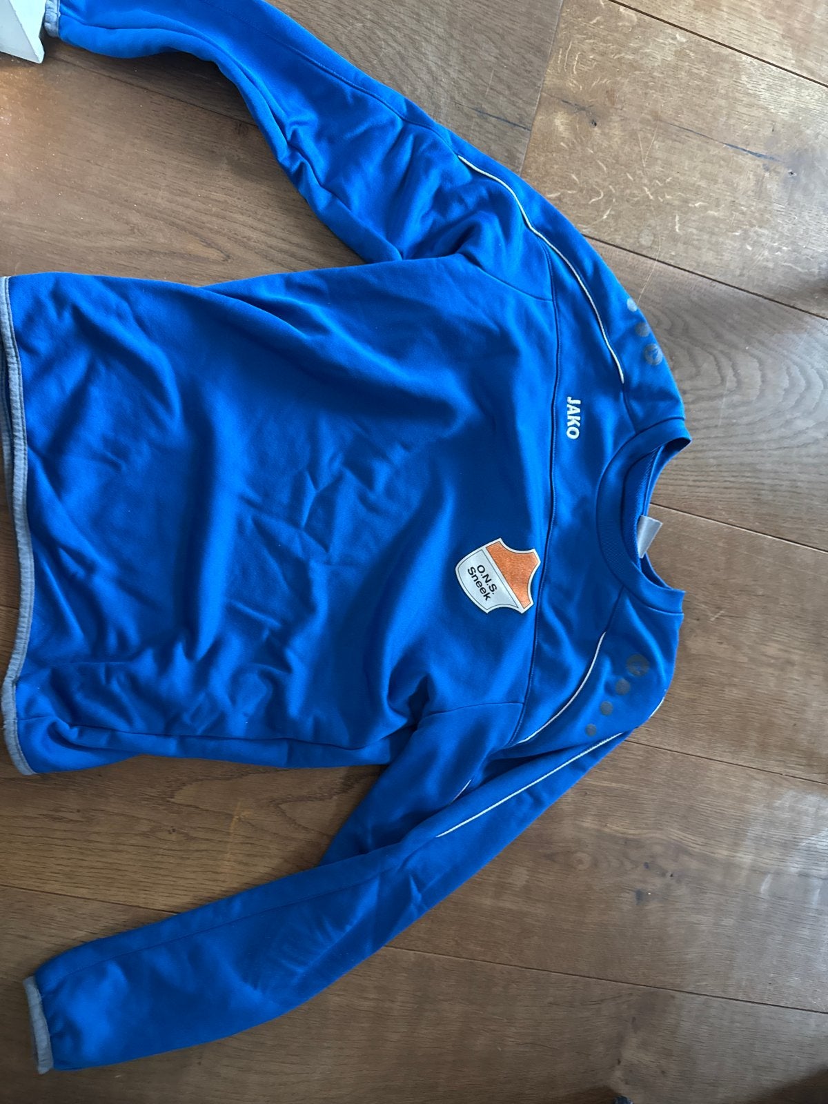 Jako O.N.S. Sneek Trainingsshirt - Blauw maat 164, Ophalen of Verzenden, Zo goed als nieuw, Buitenlandse clubs, Overige typen