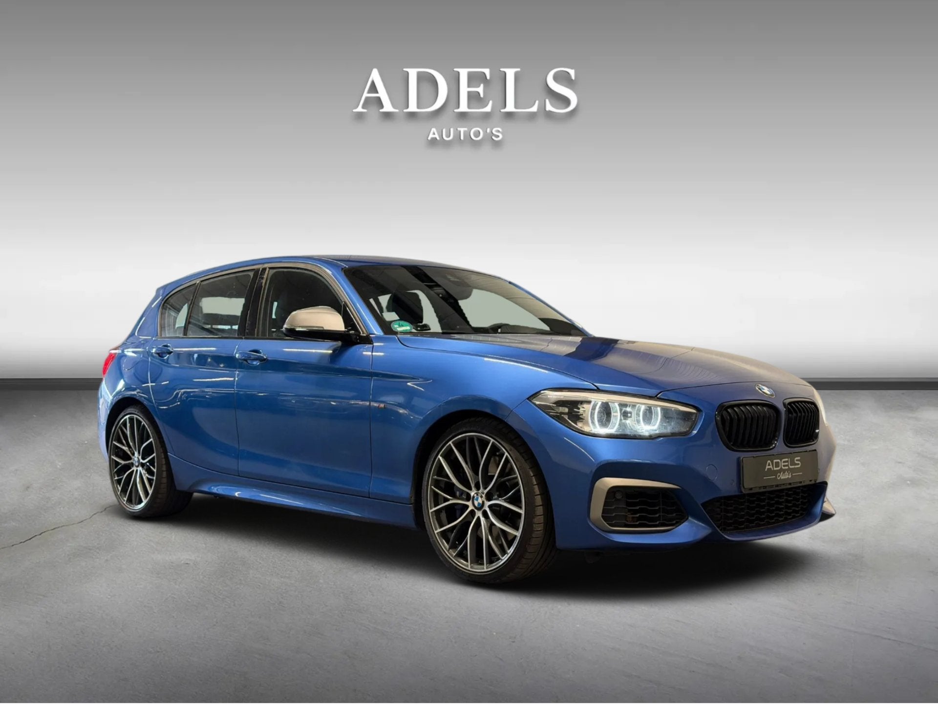 BMW 1 Serie M140i Special Edition Estoril Blauw Dealer Onder, Achterwielaandrijving, Gebruikt, Zwart, Blauw