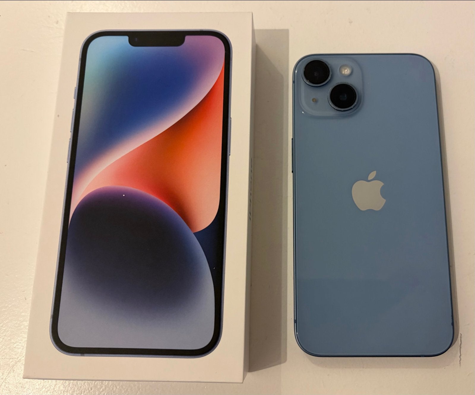 Apple iPhone 14 128GB Blauw - Zo goed als nieuw, 83 %, 128 GB, Blauw, Ophalen of Verzenden