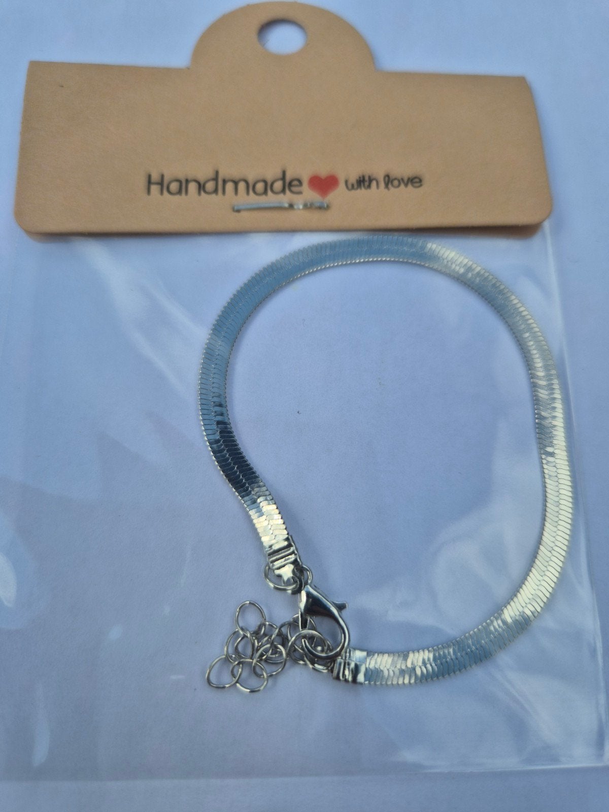 Glanzende 'slangen' armband - Nieuw en verstelbaar, Ophalen of Verzenden