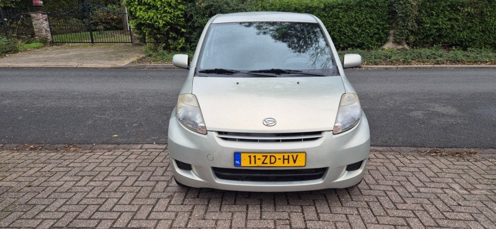 Daihatsu SIRION 1.3-16V Prestige/automaat/Airco/NAP, Auto's, Gebruikt, 4 cilinders, Met garantie (alle), Beige