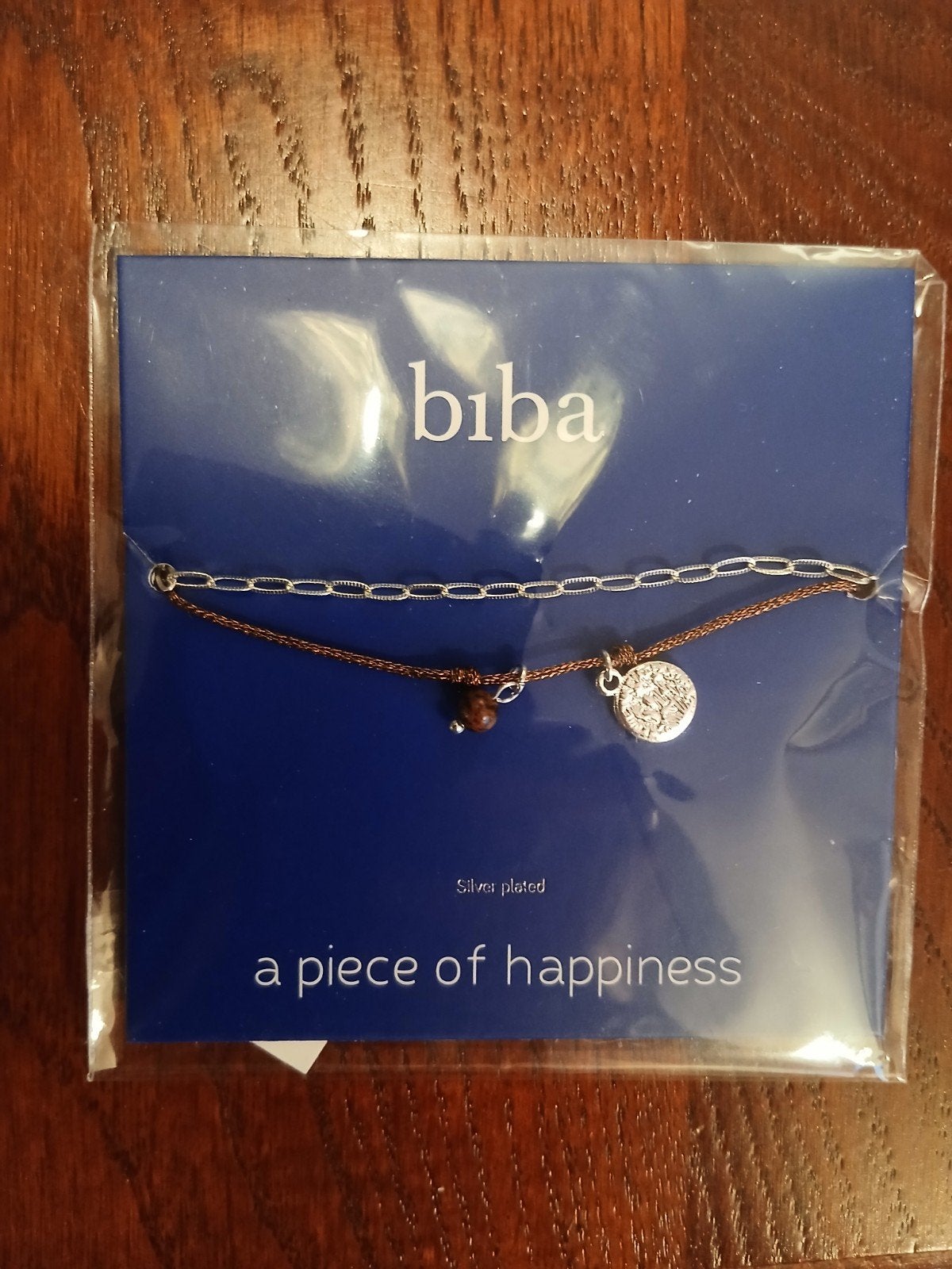 Biba Armband Zilverkleurig met Bruin Koord en Bedel, Overige materialen, Nieuw, Ophalen of Verzenden, Met bedels of kralen