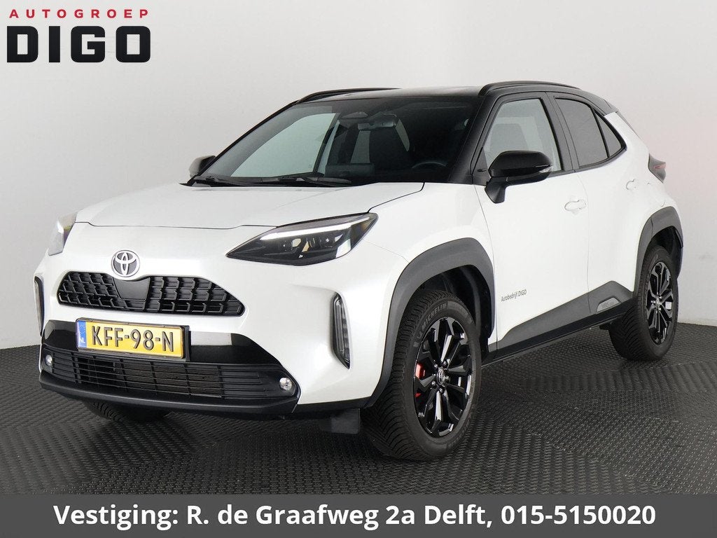 Toyota Yaris Cross Hybrid 115 Dynamic Sport Bi-Tone | Stuur-, Auto's, Toyota, Stof, 1165 kg, Automatische klimaatregeling, Wit