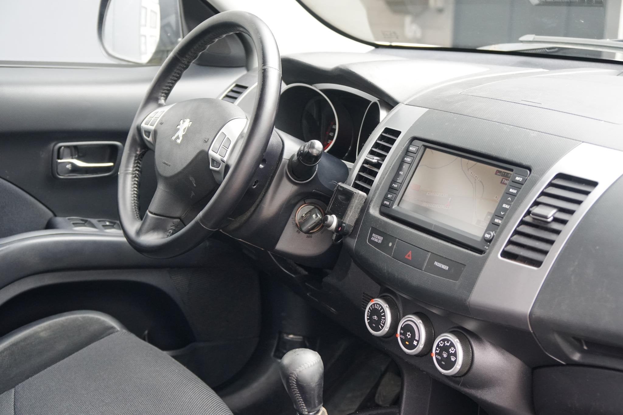 Peugeot 4007 2.4 ST 7p. + 4WD / TREKHAAK / NAVIGATIE / CRUIS, Auto's, Peugeot, Stof, Gebruikt, 4 cilinders, Bedrijf